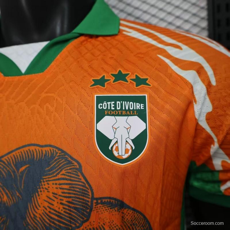 Player Version 2025 Ivory Coast Orange with Elephant Graphic and Green Accents Jersey